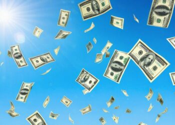 U.S. dollar bills of varying denominations float against a clear blue sky under sunlight, as if illustrating the journey of "How to Make a Million Dollars?" The money appears to be falling or flying, with bright light illuminating the entire scene, creating a sense of movement and high energy. | MAKE1M