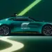 A green Aston Martin F1 car is parked against a dark green background with light green and yellow streaks. The car features branding from Aramco and the FIA Formula 1 World Championship. | MAKE1M