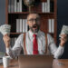 A bearded man with glasses and a red tie is sitting at a desk, holding stacks of dollar bills in both hands. He appears excited, immersed in tips on "How to Make 2 Million Dollars," with a laptop in front of him and a bookshelf in the background. | MAKE1M